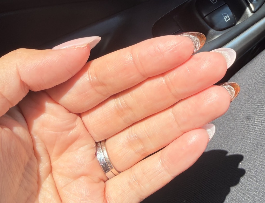 Soft natural almond-shaped nails with a thin French tip